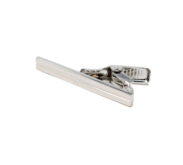 Polished silver tie clip with line.