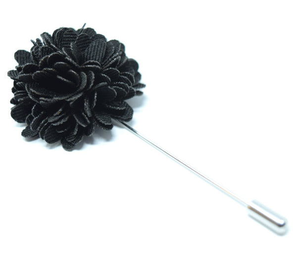 A black flower lapel pin or a suit.