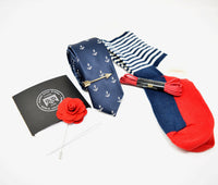 Pre-styled box with navy, red, and white colours. Kings Stay Kings boxes come with a pocket square, lapel pin, tie, tie bar, shoelaces, and socks.