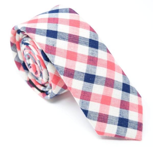 Checkmate tie is handmade and has a white, navy, and red plaid pattern.