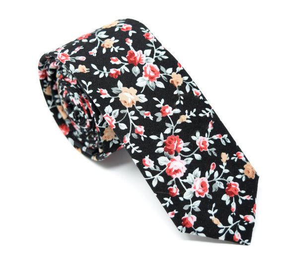 Handmade cotton black tie with red and pink floral pattern.