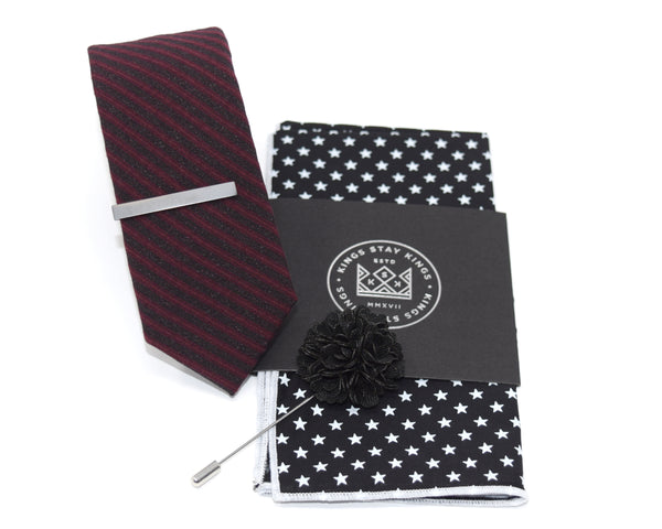 A pre-styled box with a tie, tie clip, pocket square and lapel pin.