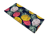 Navy pocket square with a variety of coloured pineapples.