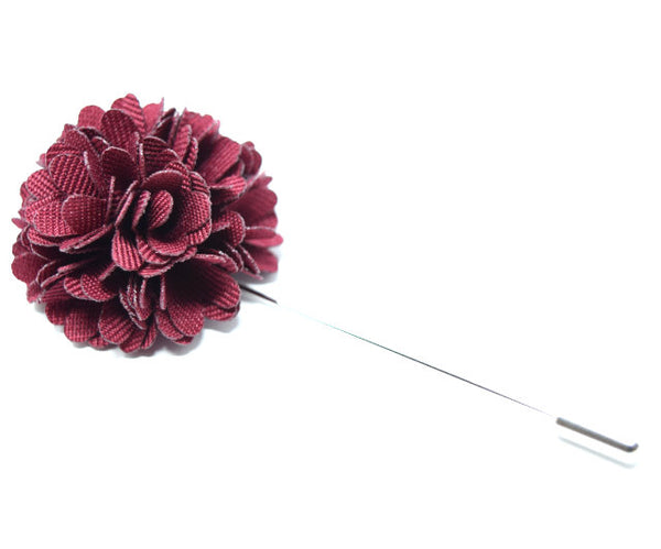 A red wine coloured flower lapel pin for a suit.