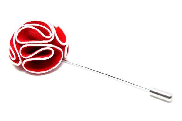Red and white flower lapel pin.