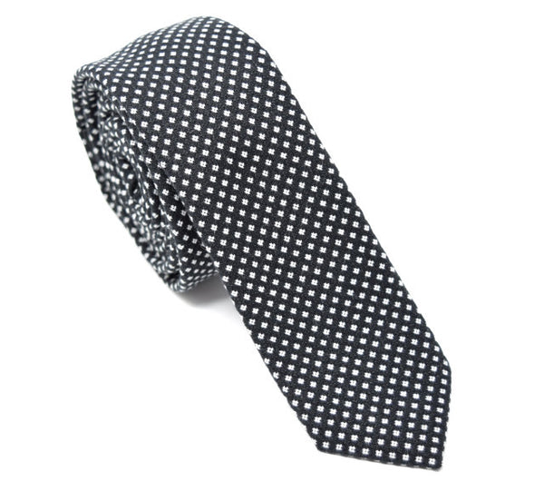 Black tie with small white polka dots.