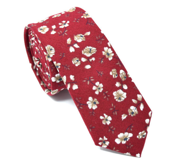 Red tie with floral pattern.