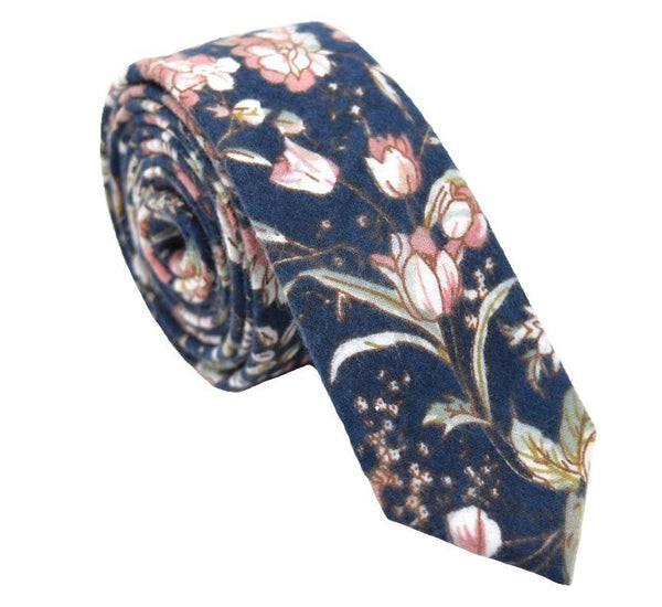Blue skinny tie with a dusty rose floral pattern.