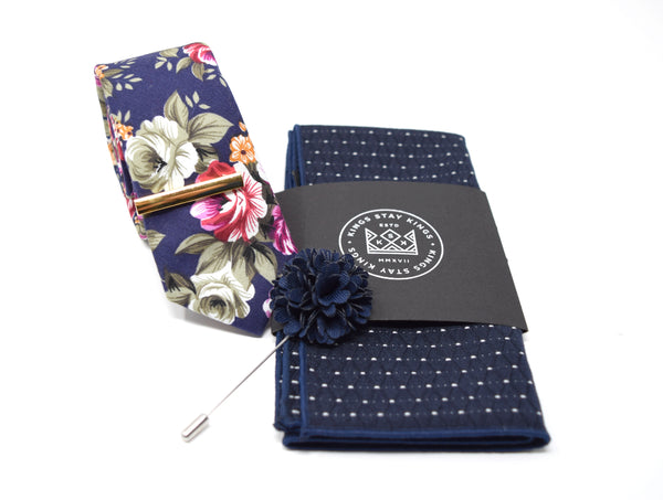 This pre-styled box comes with our most popular floral tie, gold tie bar, navy with white marking pocket square, and navy flower lapel pin.
